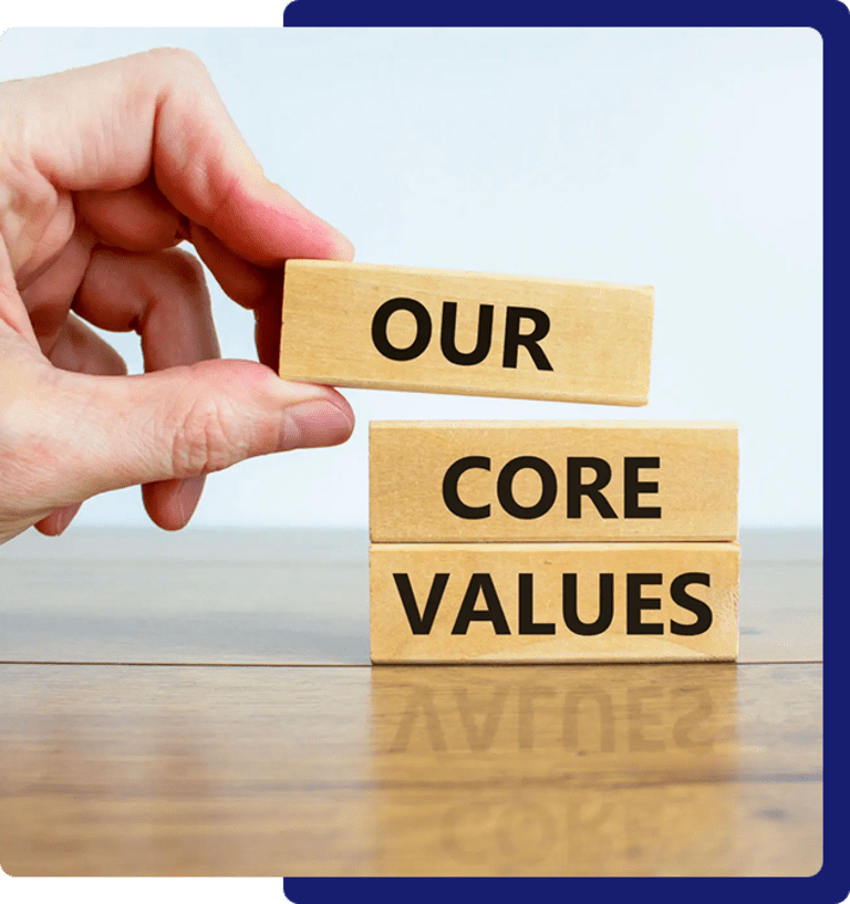 Hand stacking blocks reading "Our Core Values".